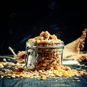 Granola in jar and sprinkled on table