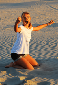 teen girl happy on beach