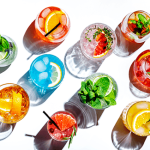 colorful spritzer drinks on white table
