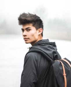 teen boy looking over shoulder